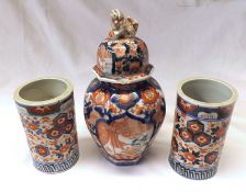 A Japanese Imari Covered Vase, the lid applied with a temple dog finial; a pair of similar
