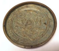 An Oriental Bronze Circular Medallion, embossed with cranes, foliage and central turtle, 4 ½”