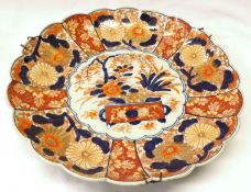 A Japanese Imari Dish of circular scalloped form, typically decorated in traditional colours with