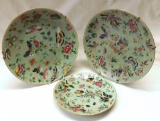 A collection of three Chinese Celadon Plates, each typically decorated in famille rose and verte