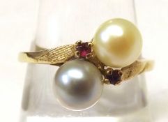A two-tone Cultured Pearl and two small Ruby Ring of crossover design, stamped “10K”