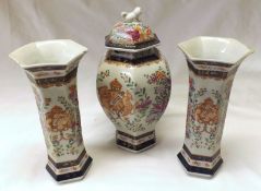 A Samson Three Piece Garniture, comprising a Lidded Baluster Vase and a pair of matching Trumpet