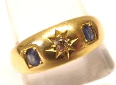 An early 20th Century Centre Small Diamond and two small Sapphire Ring, Gypsy set, hallmarked for