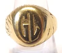 A Gents Signet Ring, the oval front panel engraved with the Initials “G L”, engraved shoulders,