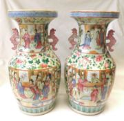 A pair of large Canton style Baluster Vases, typically decorated in famille rose, verte and