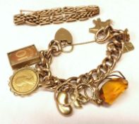 A hallmarked 9ct Gold Hollow Link Charm Bracelet, suspending numerous charms including Gold