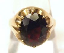 An Oval Garnet Dress Ring, claw set, hallmarked 9ct Gold