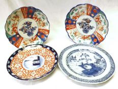A pair of Japanese Imari Plates, typically decorated in traditional colours; a further Nanking Plate