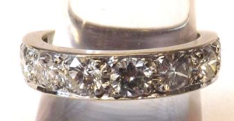 A high grade precious metal Half Eternity Ring set with eight brilliant cut Diamonds of