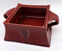 A Moorcroft Flamminian Red Glazed Square Box with embossed roundel handles, Liberty & Co stamp and