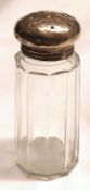 An early 20th Century Sugar Sifter, hallmarked lid and clear cut glass body, 4 ½” high