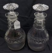 A pair of 19th Century Clear Glass Decanters, the bodies decorated with cut banding and fluted