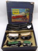 A Hornby 0-Gauge MO Passenger Set, in original box, comprises Tinplate Loco Tender; two Carriages;