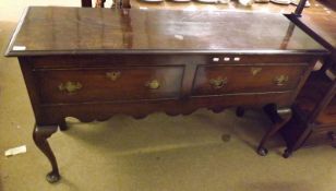 A Reproduction Oak Dresser Base of rectangular form with moulded edge, the frieze fitted with two