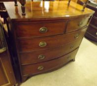 A first half of the 19th Century Mahogany Bow Front Five Drawer Chest, of two short and two long