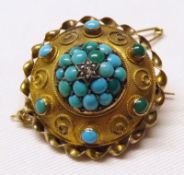 A Victorian Gold Circular Brooch, the raised centre pavé set with Turquoise stones and central small