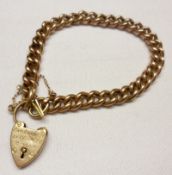 A hallmarked 9ct Gold Hollow Curb Link Bracelet, with 9ct Gold Padlock, the padlock bearing a name