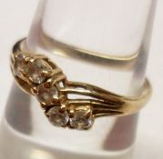 A hallmarked 9ct Gold Five Stone Cubic Zirconia Ring of crossover design