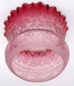 A Cranberry and Frosted Glass Oil Lamp Shade, decorated with a design of sprays of hops, 4 ½” base