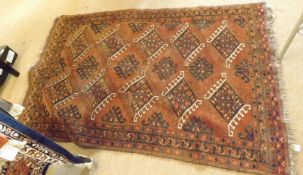 A Caucasian Carpet with triple gull border, central panel of lozenges, mainly dark rust field, 5’