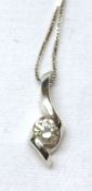 A modern hallmarked 18ct White Gold Loop Design Pendant, set with a single Brilliant Cut Diamond