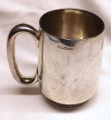 A late Victorian Tankard, of typical plain form with looped handle, Sheffield 1884, with later