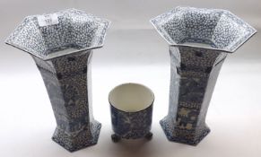 A pair of early 20th Century Adams Octagonal Vases, decorated with an Oriental type design; together