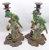 A pair of 20th Century Ceramic and Metal Candelabras, the centres formed as perching parrots with