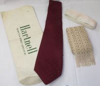 A 1970s Norman Hartnell Gents Tie in pure burgundy silk, still retained in original packaging;