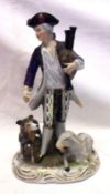 An early 20th Century Continental Figure of a musical gent with attendant dog and sheep, 7” high