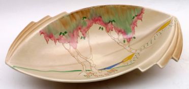 A Clarice Cliff Oval Dish, decorated with a scene of coastal trees, 13” wide