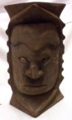 A Carved African Hardwood Bust, inset cowrie shell eyes, (overall very worn condition), 10” high