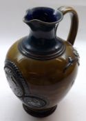 A Doulton Burslem Stoneware Ewer, decorated with a raised designs of sprays of jasmine and central
