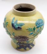 A Chinese Baluster Vase, relief moulded with birds and flowering foliage, butterfly and decorated in