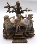 A 20th Century Austrian Wien Figure Group of three children with bocage type back (some chips and
