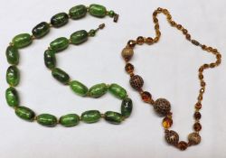 A Vintage Set of Green Amber-style Beads and a Carved Nut and Amber Glass Necklace (2)
