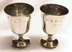 A pair of Queen Elizabeth II Goblets, the plain tapering bowls to knopped stems, raised on spreading