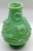 An early 20th Century Opaque Jade Glass Vase, in the Art Deco style, decorated with raised floral