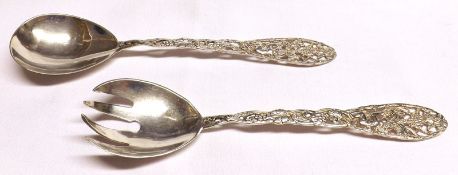 A 20th Century pair of Continental white metal Salad Servers, the stems decorated with pierced