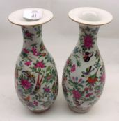 A pair of famille rose Vases of baluster form, the flared necks and the bodies painted in typical