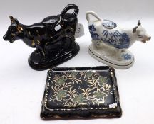 A Mixed Lot comprising: a 19th Century Willow Patterned Staffordshire Cow Creamer (damage to