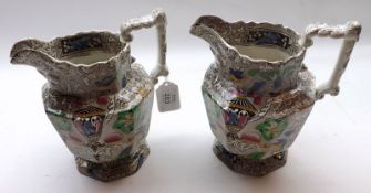 A pair of Victorian Octagonal Jugs, decorated with design of urn, flowers and birds, 7” high
