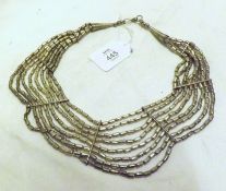 An unusual Ethnic Silvered finish Multi-Strand Necklace, approx 8” diameter