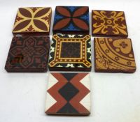 A collection of seven small Tiles, predominantly decorated in the geometric and Arts & Crafts
