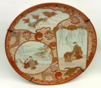 A Kutani Circular Wall Plate, painted in typical colours with panels of figures and scenes, on an