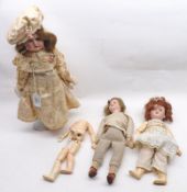 A collection of three Bisque Head Dolls comprising: an unmarked Bisque Head and Shoulder Plate
