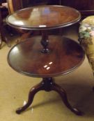 An early 19th Century Mahogany Two Tier Dumb Waiter, with turned pedestal and raised on a tripod