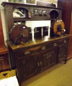 A late 19th/early 20th Century Oak Dresser in the Arts & Crafts manner, the mirrored back with