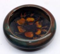 A Moorcroft Small Circular Flambé Pin Bowl or Ashtray, in an Anemone pattern, circa 1938, 4 ½”