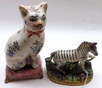 A Mixed Lot comprising: a 19th Century Staffordshire Model of a zebra (crude repairs to ears) and